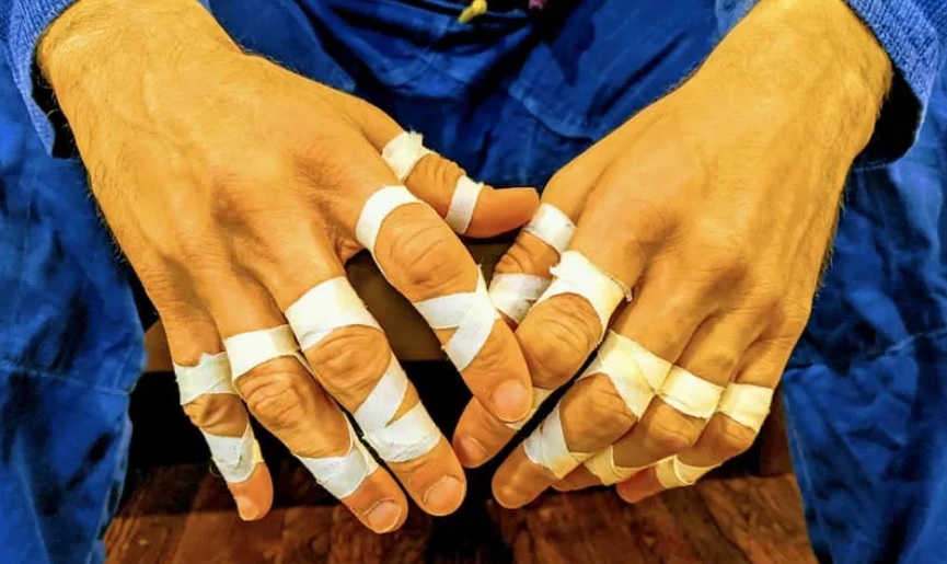 Grapplers may tape their fingers to avoid injury.