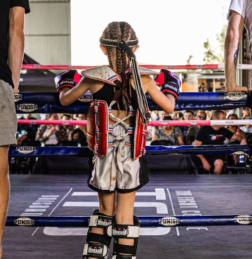 A young fighter before the beginning of the kids fight.